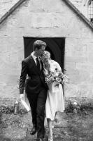 bride and groom happily leaving church in oxfordshire